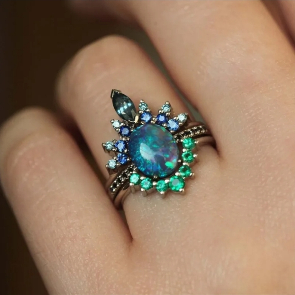 Blue-Green Opal Halo Ring with Blue and Emerald Accents